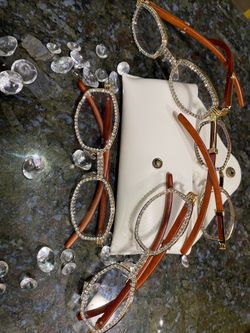 One (1) Millionaire Executive Unisex wooden frame with sparkling lab, diamond ice trim. Comes with a white protective case for secure storage. Comfort