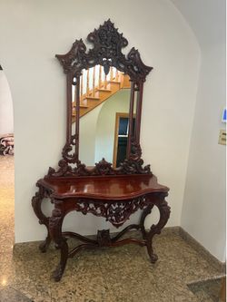 **Antique Console Table & Mirror Set**  Stunning antique-style solid wood console table with intricate hand-carved detailing and a matching oversized 