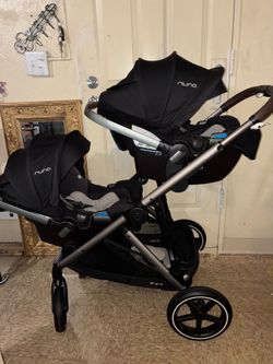 Nuna stroller with two car seats