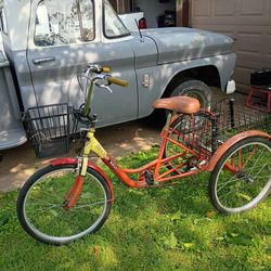Orange three wheel bike