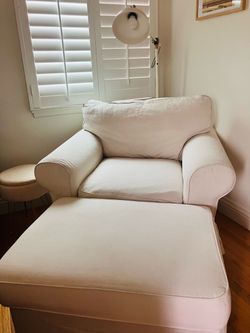 Cream IKEA arm chair and ottoman