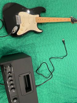 electric Strat guitar and fender mustang lt25 amp
