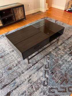 Dark wood and glass coffee table with storage