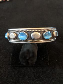 $55. Heavy sterling cuff bracelet marked TL-120 Mexico 925. 31 grams. Baby blue colored beads. Great vintage piece.
