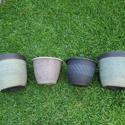 4 Plastic Pot Plants. 10.50 H.   and 8.50 H