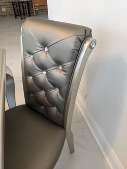 Gray color Dining Table with six tufted chairs