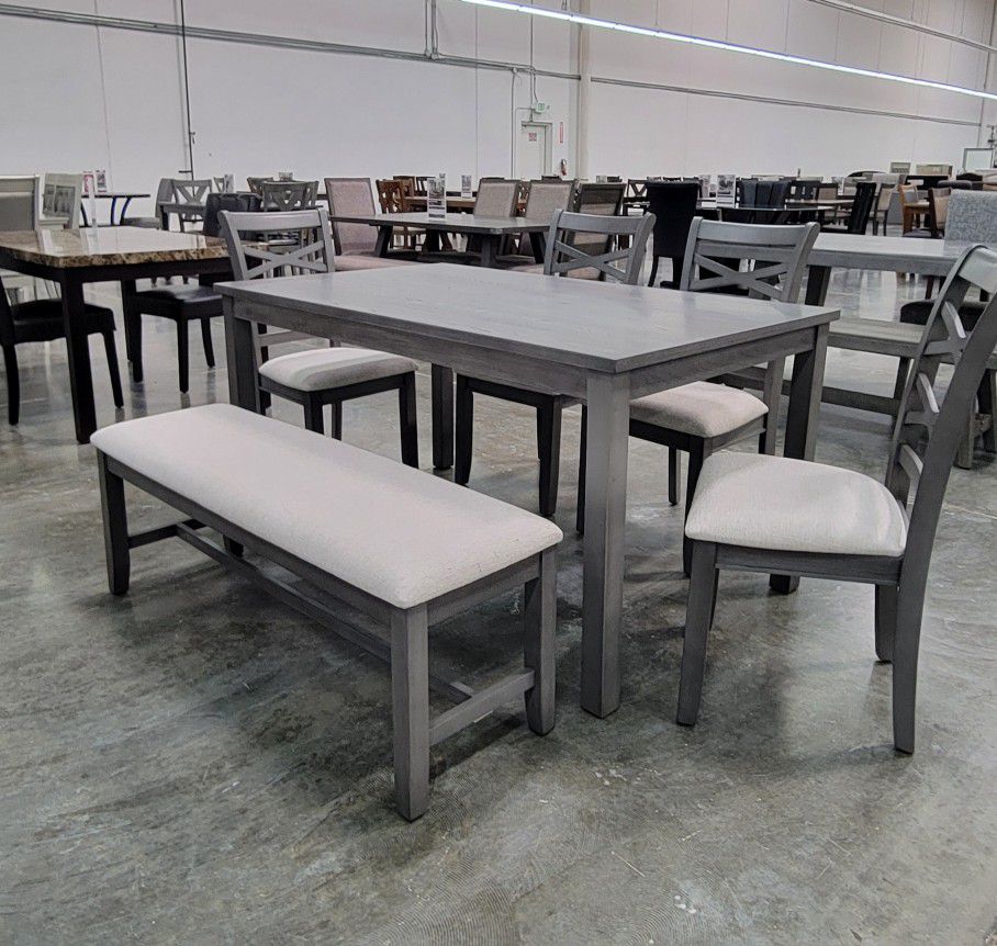 6 pc  ligght grey finish wood dining table set padded seat chairs and bench. This set includes the table and 4 side chairs padded seats and a bench. T