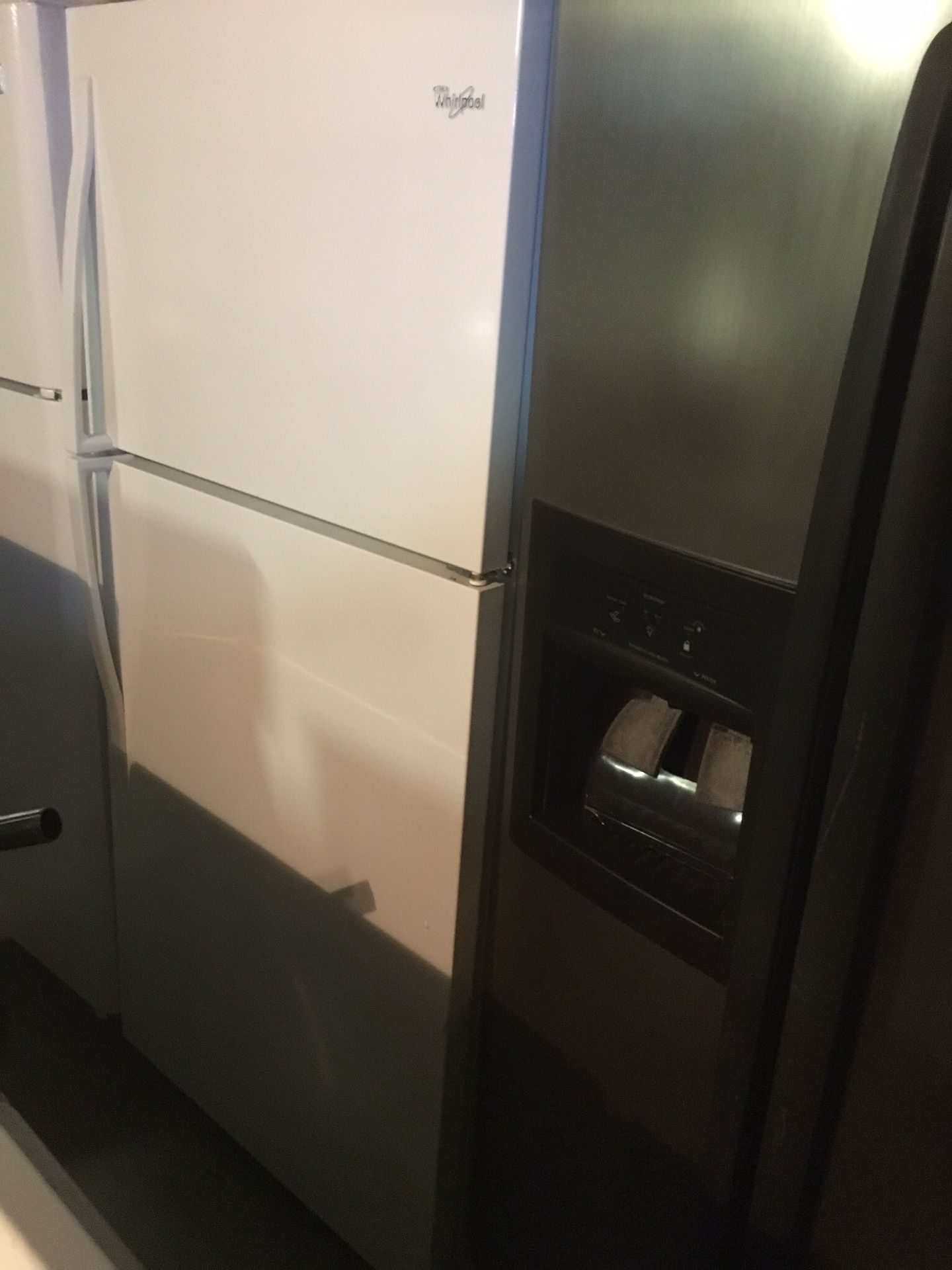 White whirlpool refrigerators/ 33 inch wide/ one year warranty
