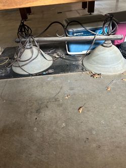 Pool table with light and stick rack