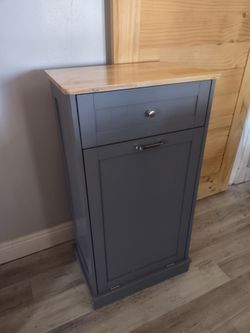 Brand new Ashley wood organizer 38x21x14 Heavy duty. Perfect for tall trash can.