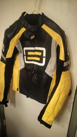 Small yellow/black/white biker jacket with a Medium Suzuki GSX  helmet