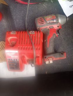 Used Milwaukee battery charger And Impact