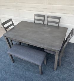 6-PC GRAY FINISHED DINING SET (TABLE, 1 PADDED BENCH AND 4 PADDED CHAIRS)