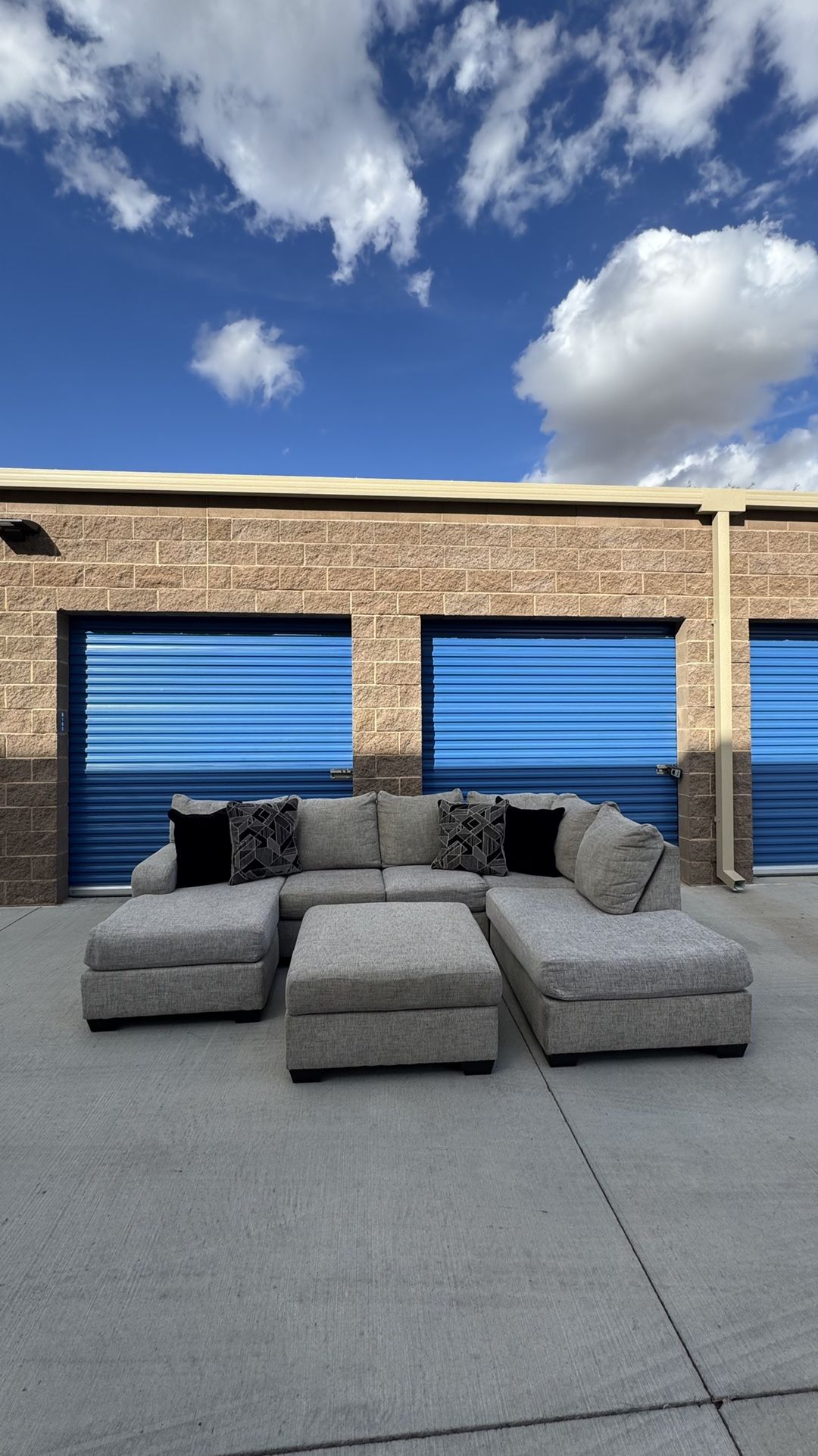 Living Spaces Grey Sectional Couch With Ottoman