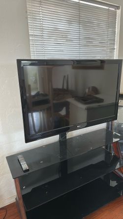 Glass tv stand with 42” LG TV
