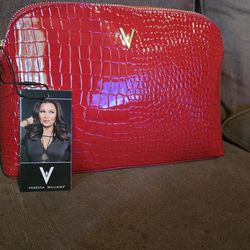 Vanessa Williams brand red crocodile-embossed cosmetic case.