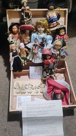 wood box of old antique and vintage dolls