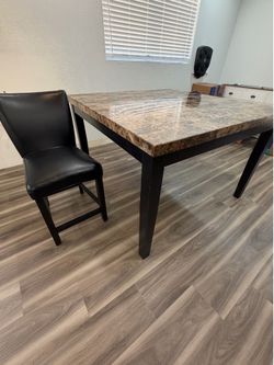Marble top dining table with 8 chairs