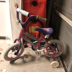 Little Girl’s Huffy Pink And Purple Hearts Bike