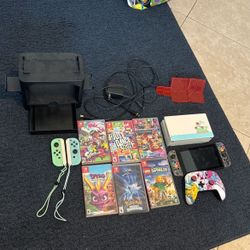 Nintendo Switch With A Bunch Of Accessories.