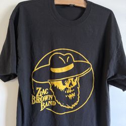 Zac Brown Band Black T-Shirt With A Yellow Skull Graphic Wearing A Hat