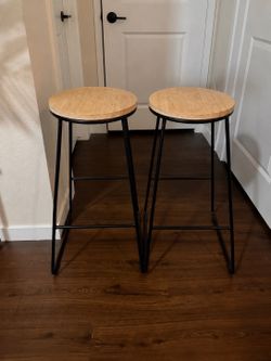 Two matching wood bar stools