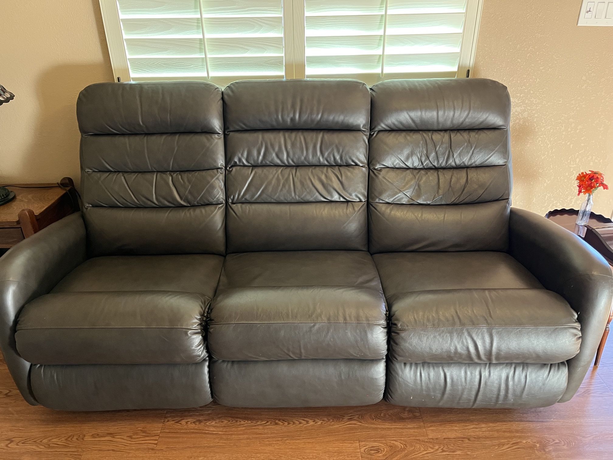 Leather Couch With Two Electric Adjustable Reclicliners  