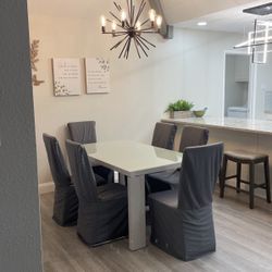 Dining table white with six chairs and covers grey color beautiful