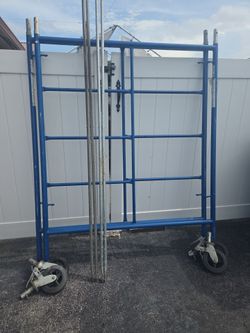 Metal scaffolding and wheels