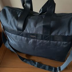 It’s Very Good Duffle Bag Made By GORGIO Armani. The Color Is Teal.