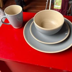 Set Or Four Dishes And Coffee Cup