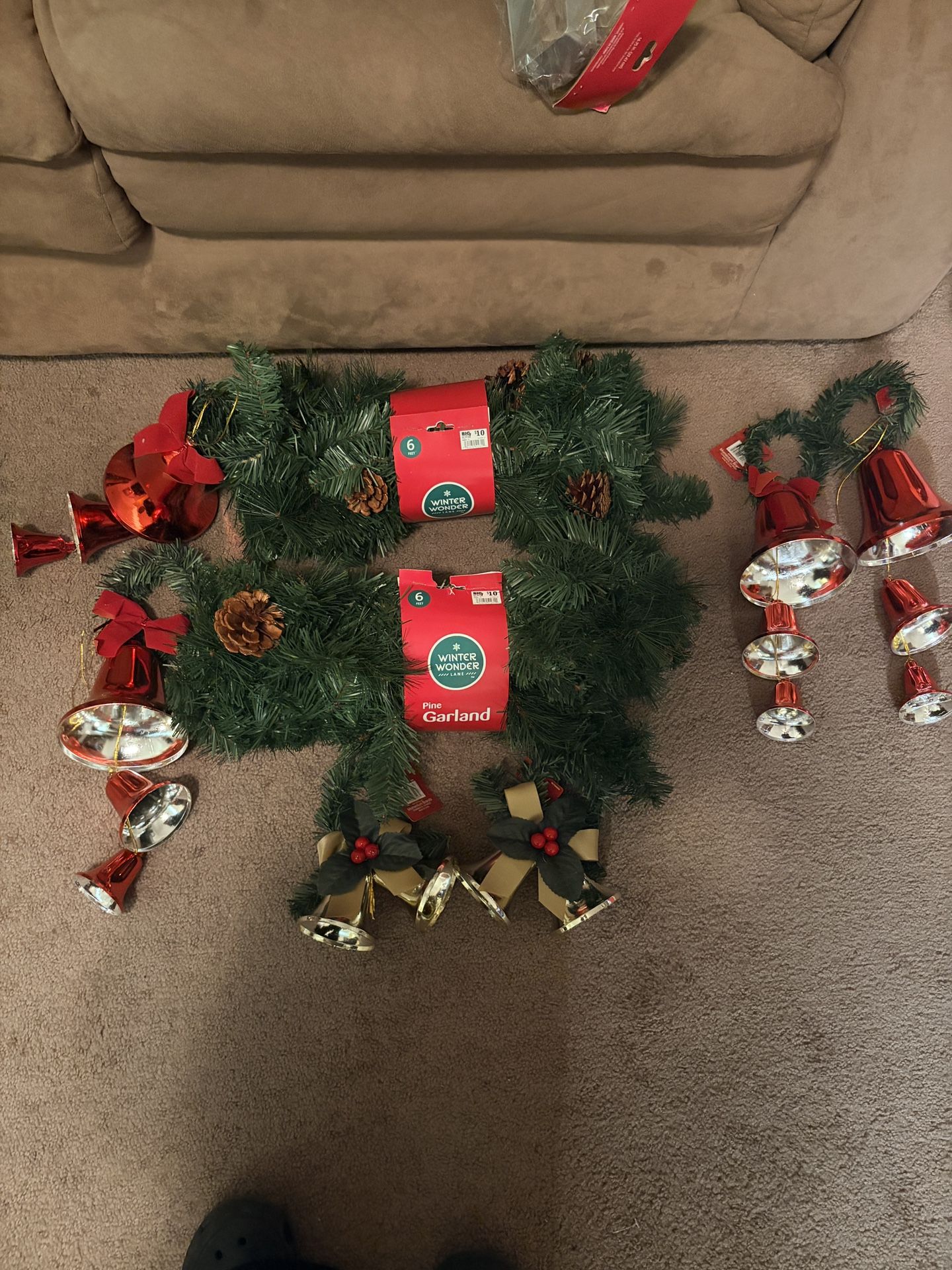 Two Faux Pine Garlands With Pinecones And Four Sets Of Bells
