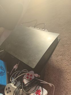 Playstation 5 with four controllers