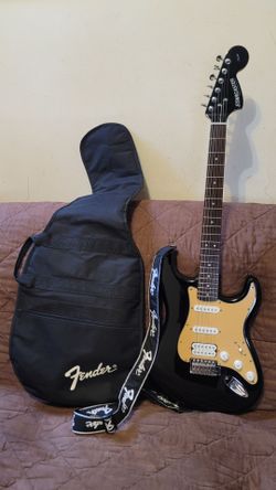 STARCASTER STRATOCASTER BY FENDER ELECTRIC GUITAR MADE IN INDONESIA IN BLACK COLOR.