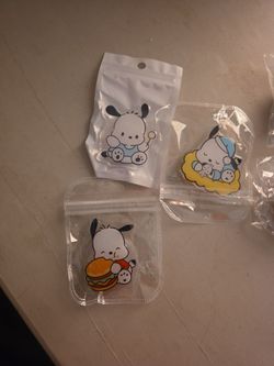 Pochacco pop socket or badge reel