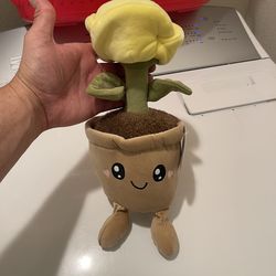 Smoochy Pals Valentine's Plant Plush Toy in yellow.  Brand: Smoochy Pals Retailer: Available at Five Below Features: Soft material with a smiling face