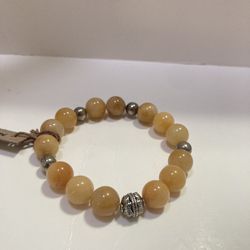 Jade Stretch Bracelet With Silver Beads.