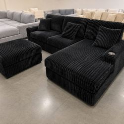 Black corduroy modular sectional sofa with ottoman