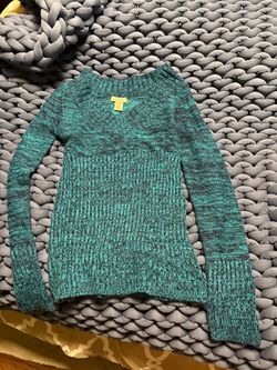 Soft marled teal knit with a classic crew neckline.