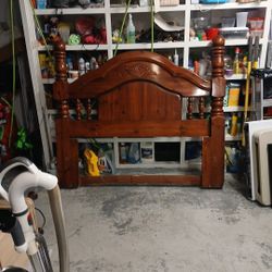 A Beautiful Headboard  And Queen Bed