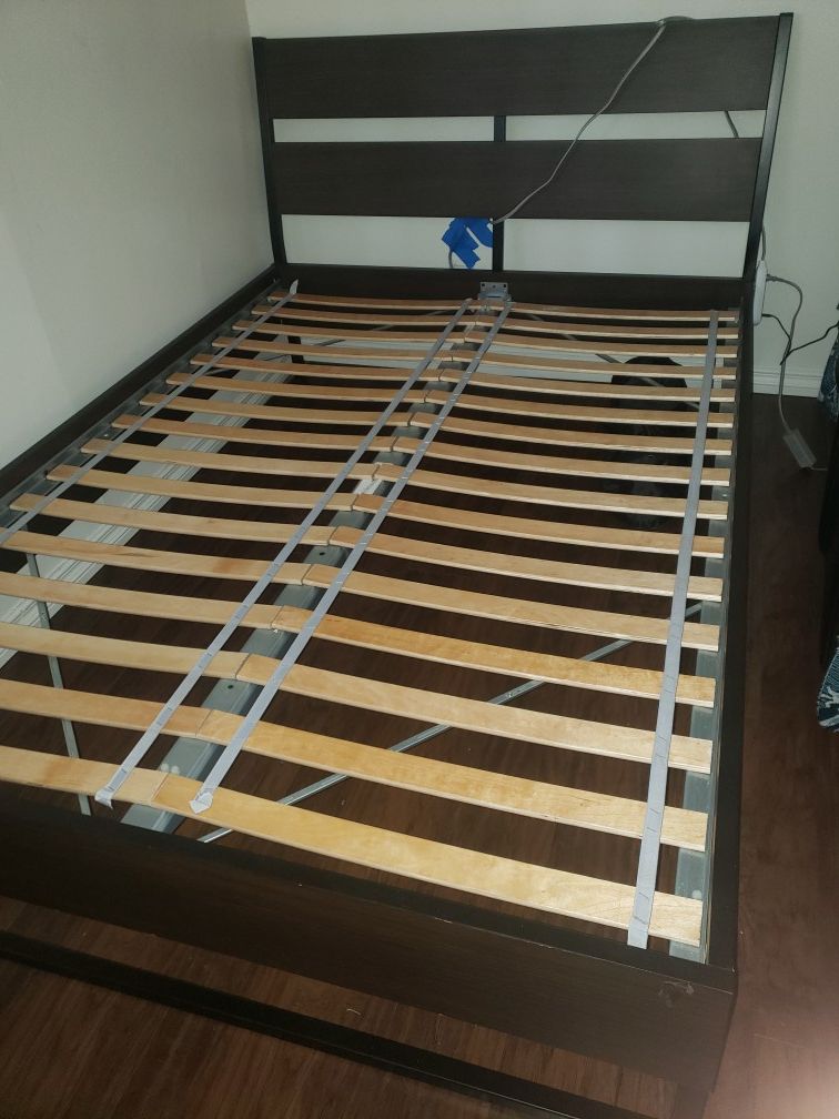 Full size bed frame brown in color