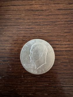 Silver dollar and silver quarter plata