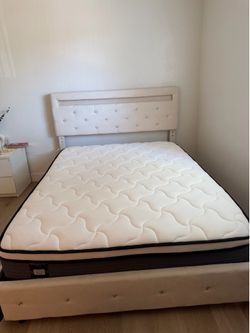 Beige queen bed frame and mattress