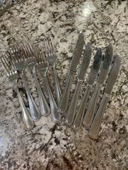 Four spoons and five knives