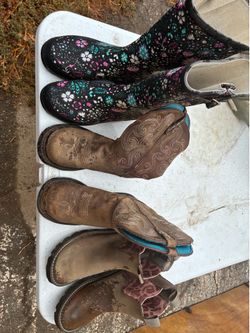 3 pairs of boots, one is Ariat