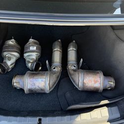 OEM downpipe assemblies removed from a BMW G90 M5 (S68