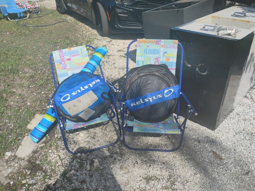 2 Beach Chairs And A Tommy Bahama Umbrella And 2 Brand New Pool Floats