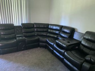 Black Leather Reclining Sectional Sofa with Cup Holders