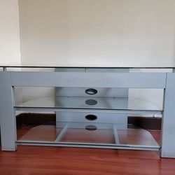 TV table/ TV stand.  Corner or wall TV table with three removable glass shelves. 
