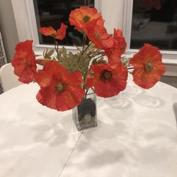 Bright, vibrant, orange, Faux Poppy Flowers in glass vase